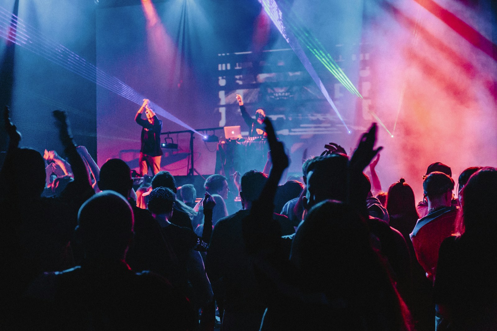 A crowd of people with raised hands at a concert in Moscow